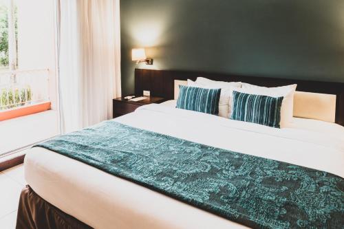 Cama o camas de una habitación en Oro Verde Machala