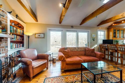 a living room with a couch and chairs and a table at Paradise On Cape Cod in Orleans