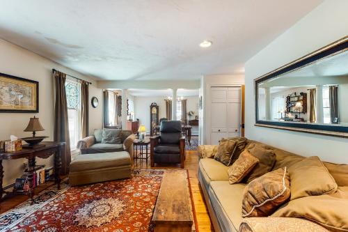 a living room with a couch and a table at Paradise On Cape Cod in Orleans
