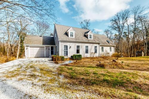 a large white house with a driveway at Paradise On Cape Cod in Orleans