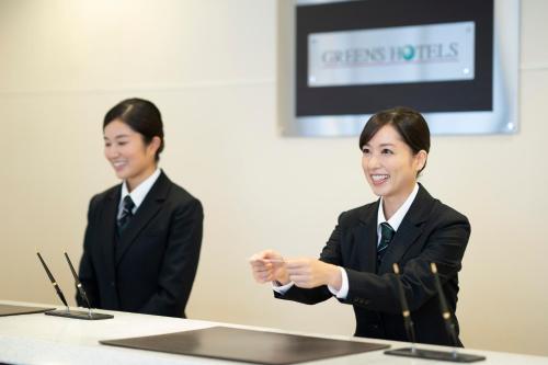 Členové personálu v ubytování Hisai Green Hotel