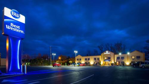 a city street at night with a blue sky at Best Western Port Clinton in Port Clinton