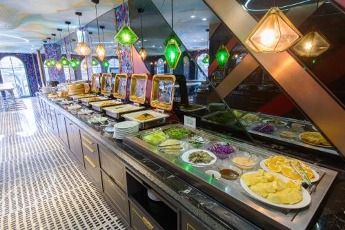 a buffet line with many different types of food at Norway Forest Travel hotel 1 Taichung in Taichung