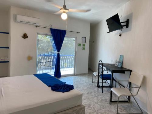 Ένα ή περισσότερα κρεβάτια σε δωμάτιο στο Hotel Paraíso Kora
