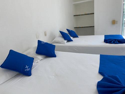Ένα ή περισσότερα κρεβάτια σε δωμάτιο στο Hotel Paraíso Kora