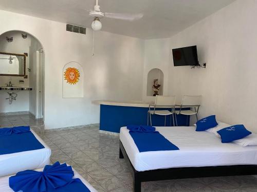 Ένα ή περισσότερα κρεβάτια σε δωμάτιο στο Hotel Paraíso Kora