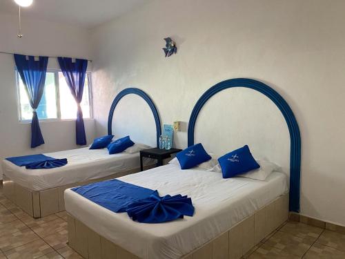 Ένα ή περισσότερα κρεβάτια σε δωμάτιο στο Hotel Paraíso Kora