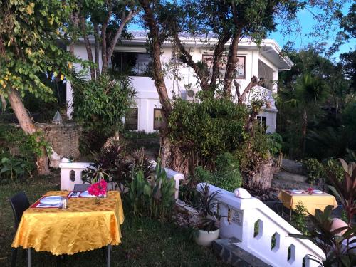 a table in the yard of a house at Argonauta Boracay Apartment Suites and Villas in Boracay