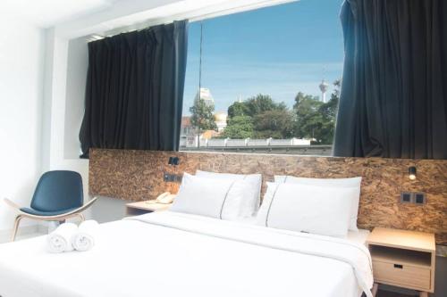 Postel nebo postele na pokoji v ubytování i-Hotel Kuala Lumpur