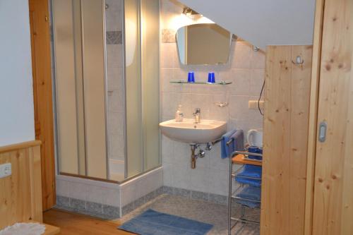 a bathroom with a sink and a mirror at Haus Trausner in Hallstatt