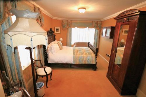 a bedroom with a bed and a window at Ebenezer's Place in Broadstairs
