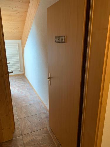 a room with a door with a sign on it at Hotel Hof und Post in Innertkirchen