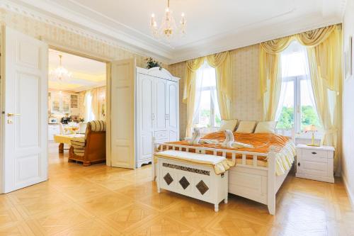 a bedroom with a bed and a desk in it at Apartmán Nostalgia in Karlovy Vary