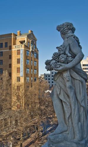 a statue of a woman holding a child at Dunhill Hotel in Charlotte