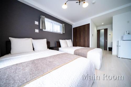 Postel nebo postele na pokoji v ubytování Roof Hanazonocho-Nishi