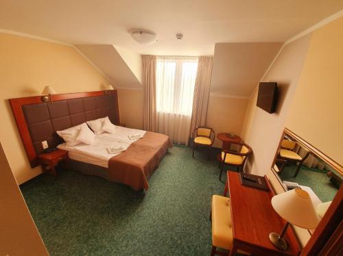 Кровать или кровати в номере Hotel Gniecki Gdansk