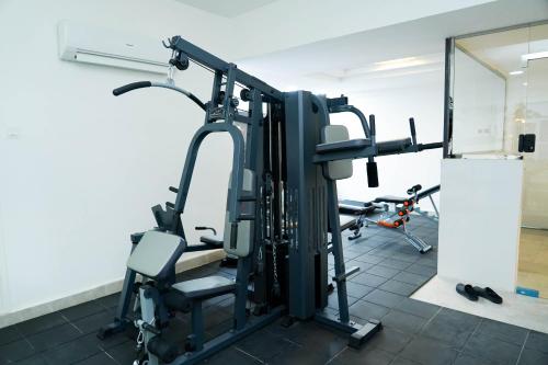 a gym with several tread machines in a room at Star Emirates Downtown Hotel Salalah in Salalah