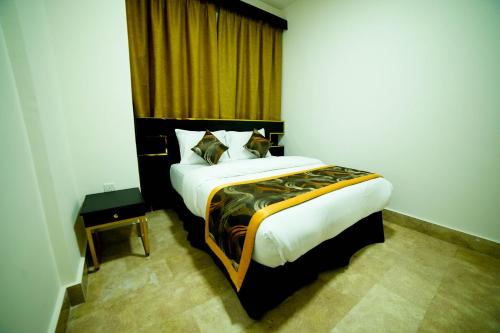Posteľ alebo postele v izbe v ubytovaní Star Emirates Downtown