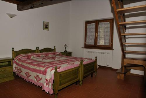 מיטה או מיטות בחדר ב-Agriturismo Il Serrino