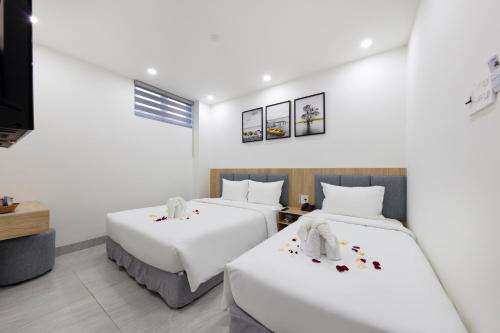 Ένα ή περισσότερα κρεβάτια σε δωμάτιο στο SALAH HOTEL