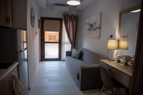 a living room with a couch and a table at Dimitra House in Stavros