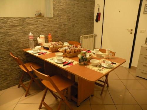 a wooden table with a basket of food on it at Affittacamere Casadio in Cotignola
