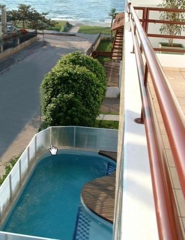 an overhead view of a swimming pool on a balcony at Ilhamar Canas Hotel in Florianópolis