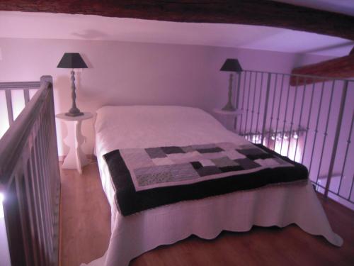 a bedroom with a bed in a room at La Gourgasse Vieille in Béziers