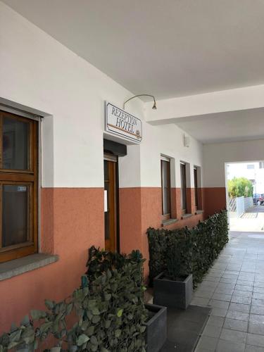 a building with a sign on the side of it at Hotel Stadt-Lindau in Neu-Ulm