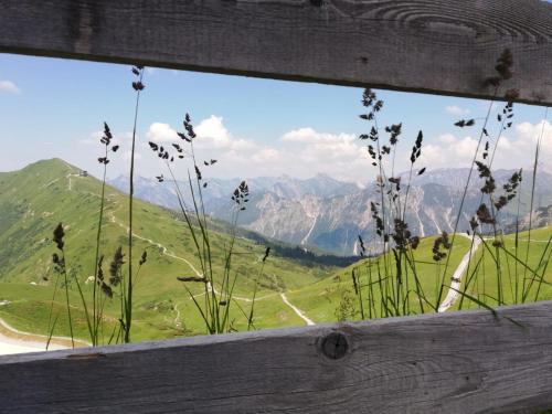 a window with a view of a mountain at Hotel Garni Malerwinkl in Bad Hindelang