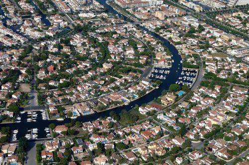 an aerial view of a city with a river at ALBERES 61-B EmpuriaRent in Empuriabrava