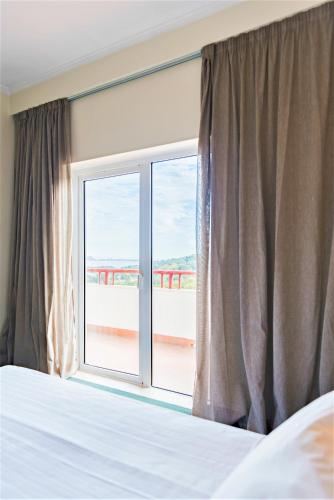 Postel nebo postele na pokoji v ubytování Amazonia Jamor Hotel