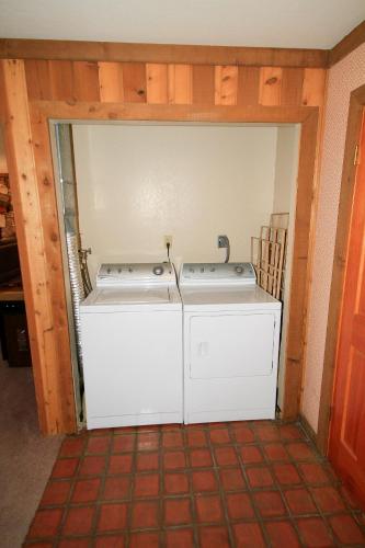 a washer and dryer sitting inside of a room at Mountainback 60 Corner Unit in Mammoth Lakes