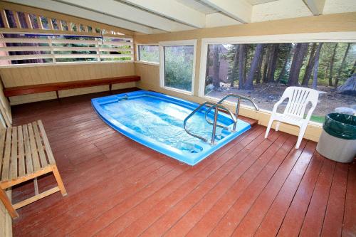 a room with a swimming pool in a house at Mammoth Ski & Racquet Club #67 in Mammoth Lakes