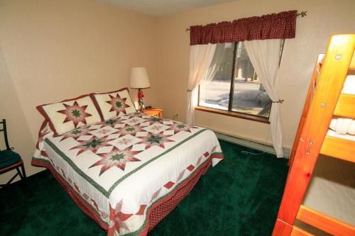a bedroom with a bed and a window at Forest Creek #3, Pet accepted in Mammoth Lakes