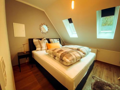 Łóżko lub łóżka w pokoju w obiekcie Trasse Belge