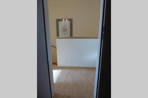 an open door to a room with a white wall at Im Herzen von Aschaffenburg in Aschaffenburg