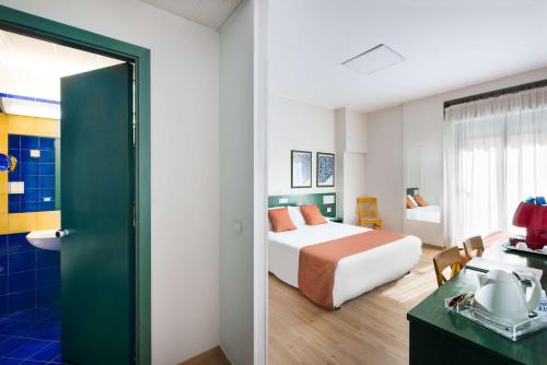En eller flere senge i et værelse på Best Western Hotel Mediterraneo
