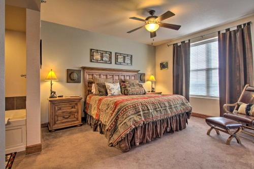 a bedroom with a bed and a ceiling fan at 2 Mi to Attractions Pigeon Forge Condo in Pigeon Forge