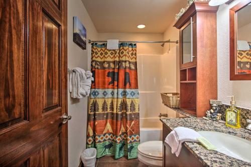 a bathroom with a sink and a toilet and a shower at 2 Mi to Attractions Pigeon Forge Condo in Pigeon Forge