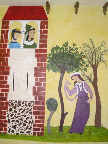 a wall with a painting of a man and trees at TORRE FUERTE Siglo XIII in Baños de Rioja
