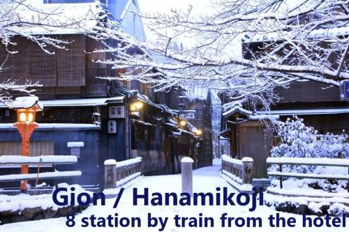 a city covered in snow with the words station by train from the hotel at UU Inn Kyoto in Kyoto