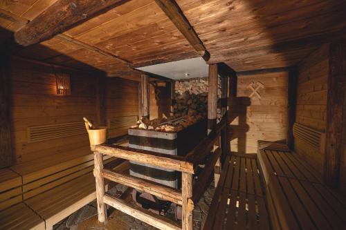 an inside view of a room in a wooden cabin at Hotel Schartner in Altenmarkt im Pongau