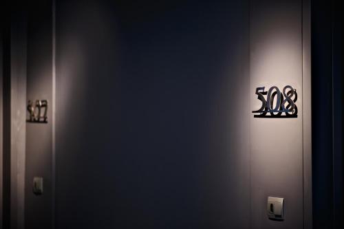 a door with a sign that says sos on it at The Suites Taitung in Taitung City