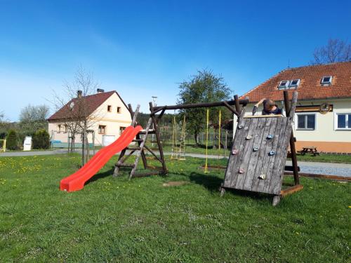 a playground with a slide at Penzion-Na Navsi in Horní Planá