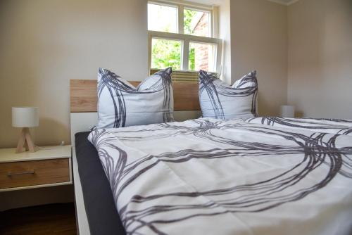 מיטה או מיטות בחדר ב-Hafenblick Greetsiel