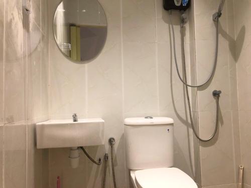 a bathroom with a toilet and a sink at Langkawi M seaview Apartment in Kuah