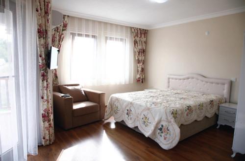 Una cama o camas en una habitación de Ankakyaka Apart Hotel