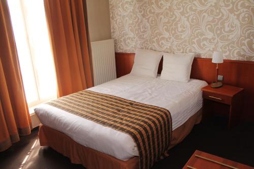 Postel nebo postele na pokoji v ubytování Hotel De Notelaer