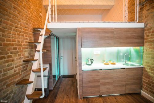 a small kitchen with a fishtank in a tiny house at Kyiv Art Apartments near Golden Gate in Kyiv